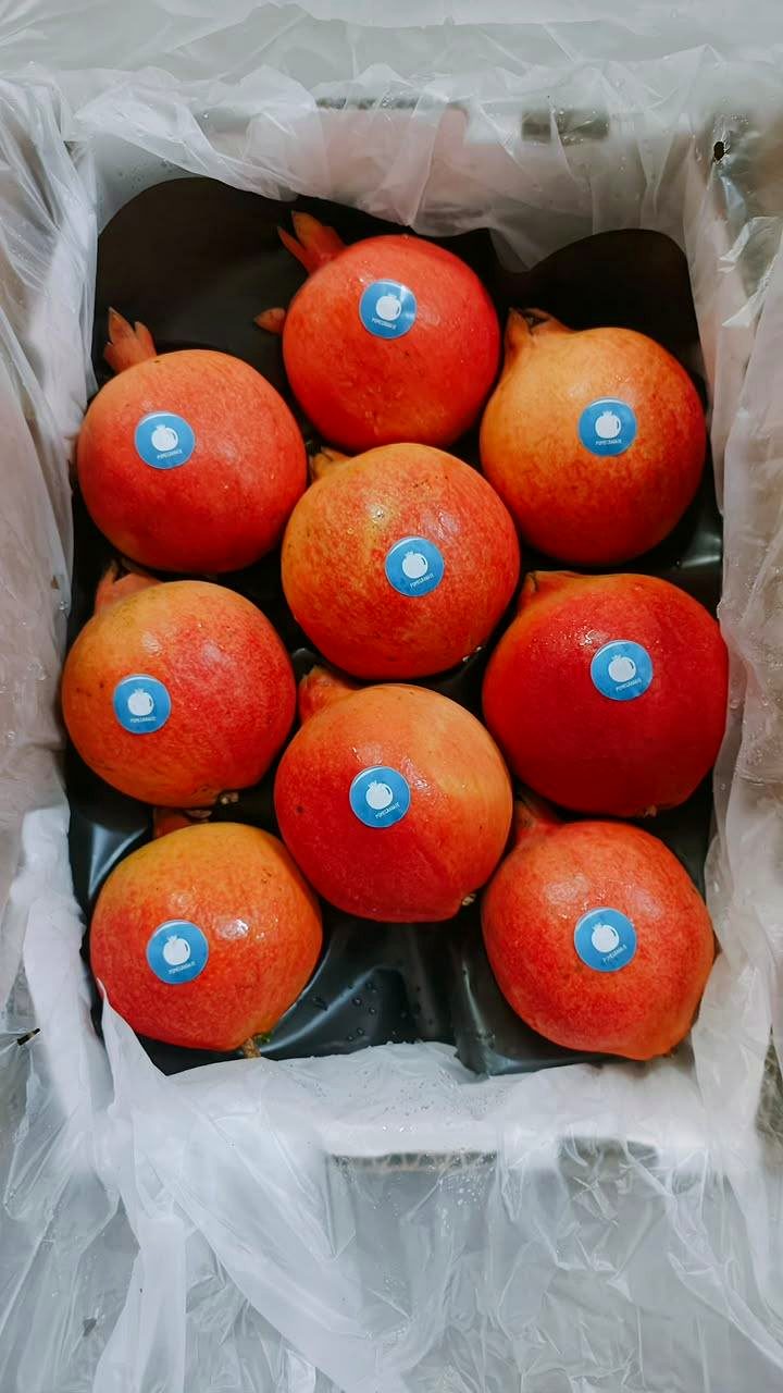 Pomegranates individually stickered for retail